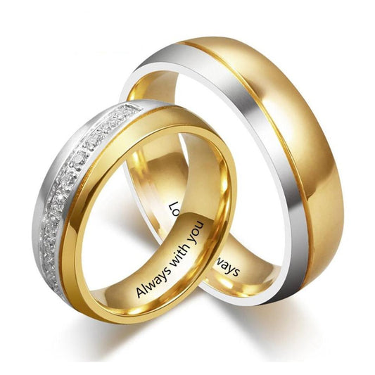Gold and Silver Stainless Steel Personalized Couple Rings.  Womens ring has cubic zirconia chips half way around the band.  Mens ring is half gold stainless steel and half silver stainless steel.  Engraving inside shows "Always with you" and "Love you always"