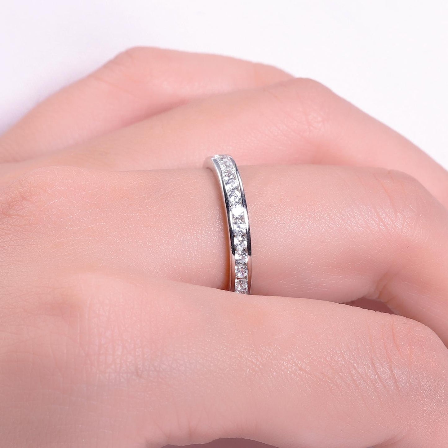 Woman wearing 0.33Ct Moissanite Eternity 925 Sterling Silver Ring